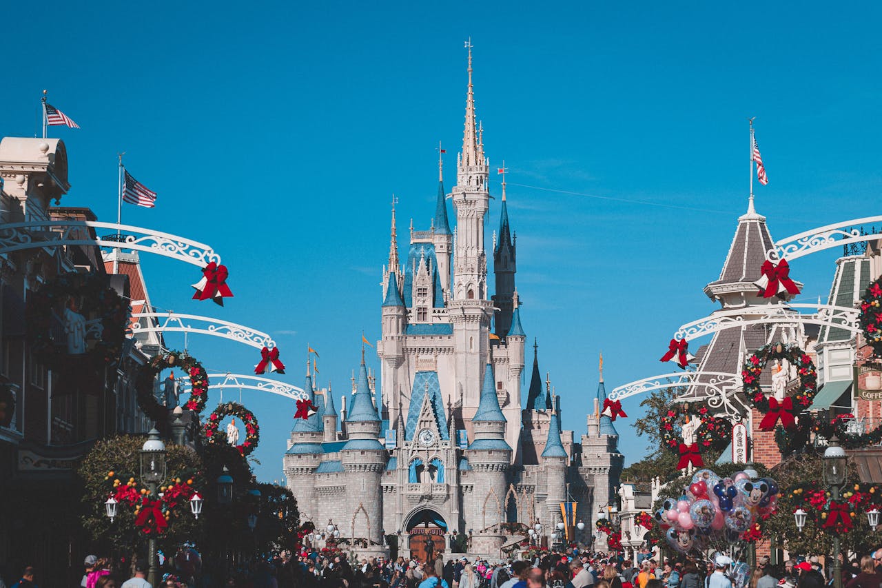 who-we-are Cinderella Castle at Disney World's Magic Kingdom adorned for holiday festivities, Orlando, Florida.
